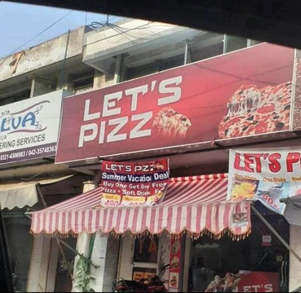 Pizza restaurant signage that says &quot;Let's Pizz&quot;